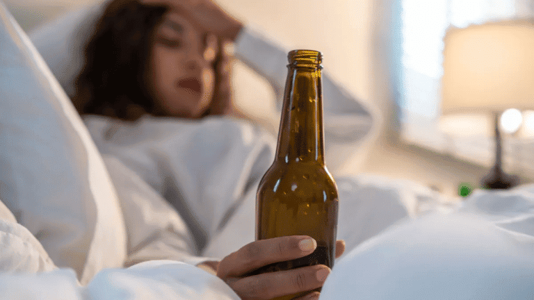 Drunk Woman in Bed Holding a Bottle | Fortis Fit